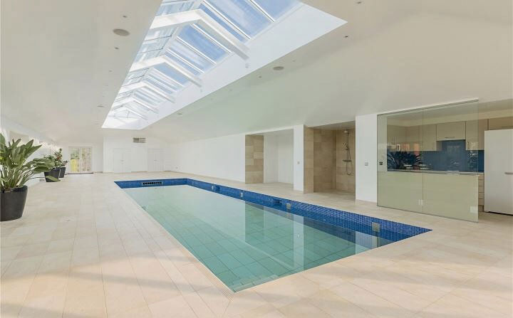 large format tiled pool with swim jet